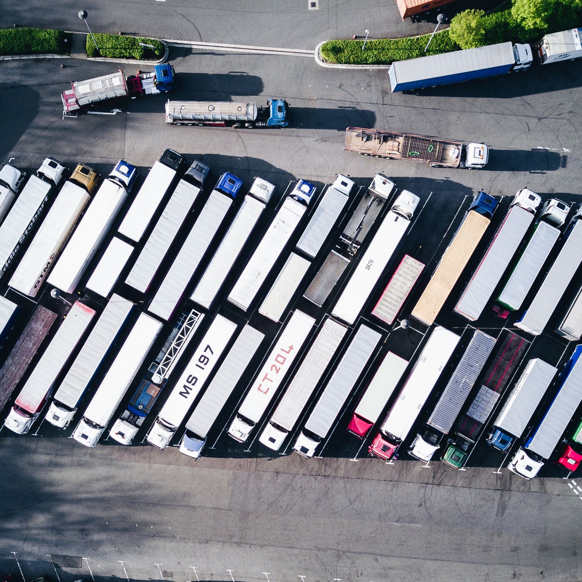 a group of people sitting in a parking lot